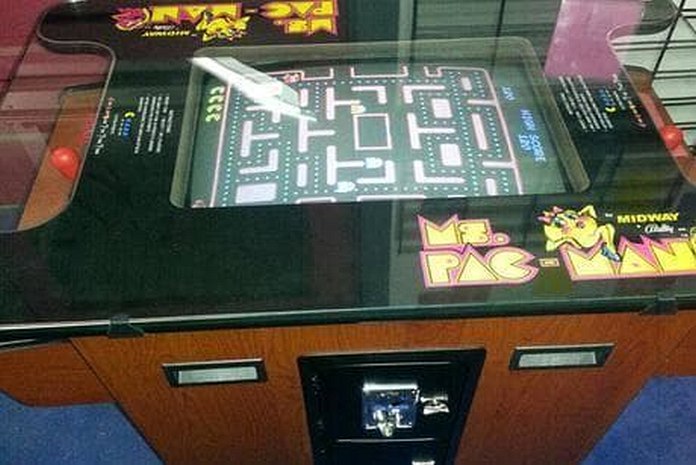 Taking a break to play Ms. Pac-Man